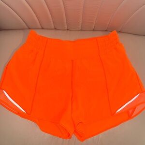 Lululemon size 8 hotty hot 4in shorts in bright orange